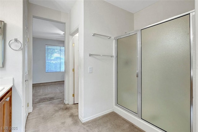 bathroom featuring an enclosed shower and vanity