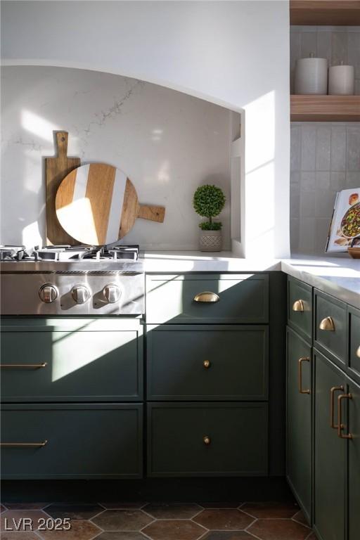 kitchen with gas stovetop and green cabinets