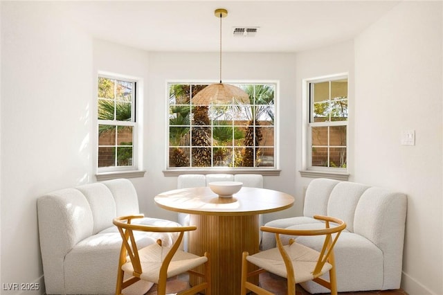 dining space featuring visible vents