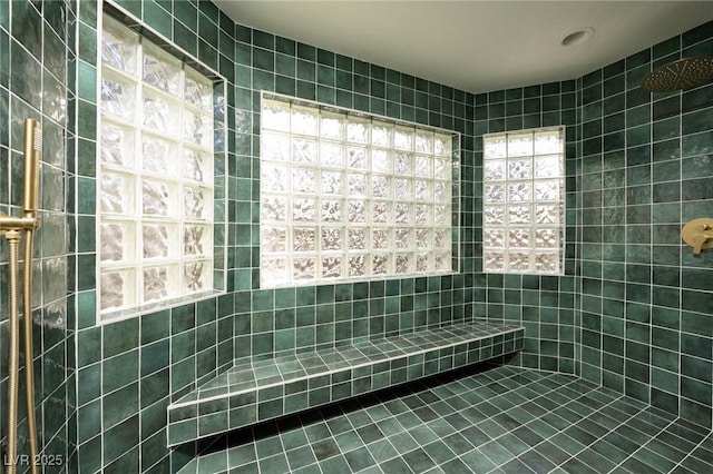 bathroom with tile patterned floors and walk in shower