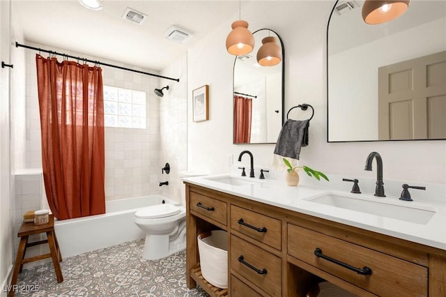 bathroom with a sink, visible vents, and shower / bath combo with shower curtain