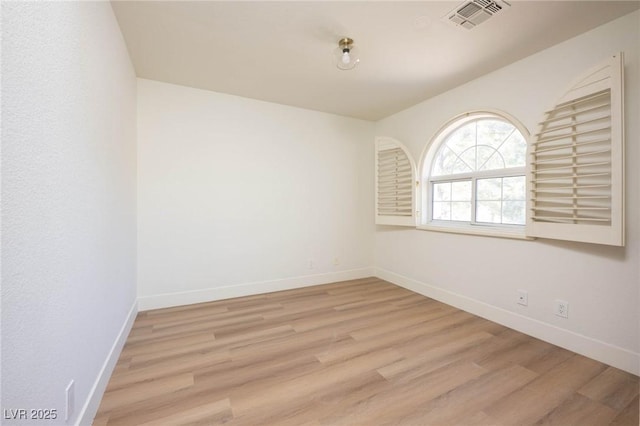 unfurnished room featuring light wood-type flooring