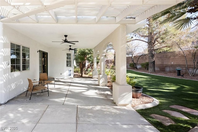 view of patio featuring ceiling fan and a pergola