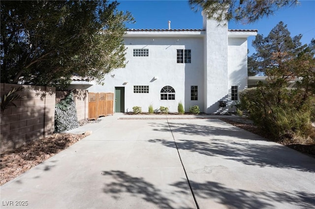 rear view of property featuring a patio