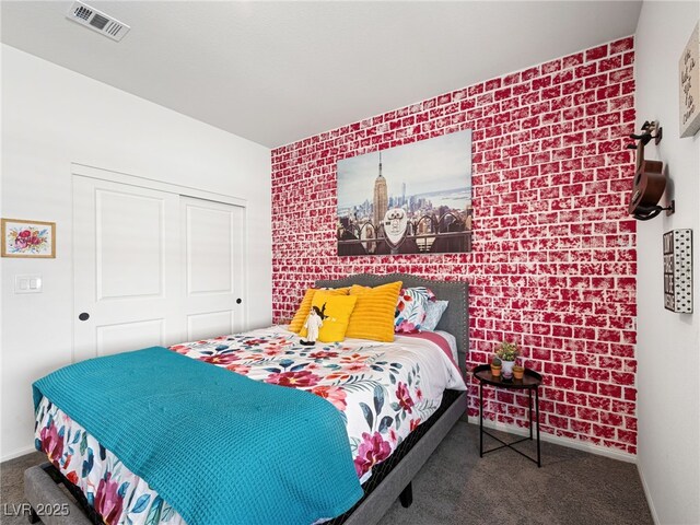 carpeted bedroom with a closet