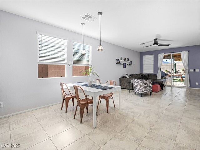 dining room featuring ceiling fan and light tile patterned floors