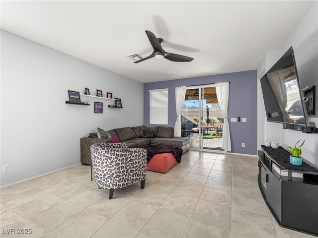 tiled living room featuring ceiling fan