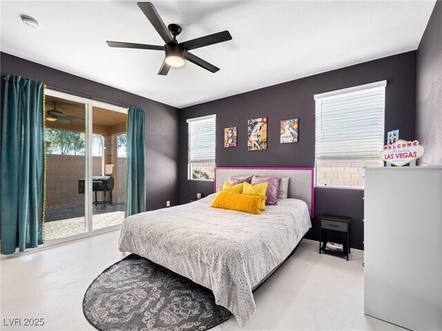 bedroom featuring ceiling fan and access to exterior