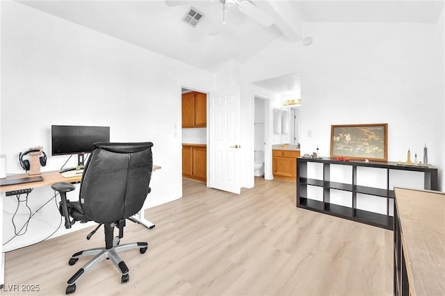 home office with ceiling fan, vaulted ceiling with beams, and light wood-type flooring