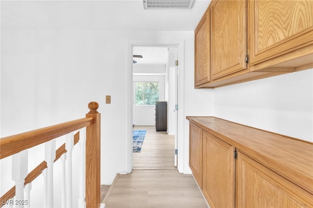 hall with light wood-type flooring