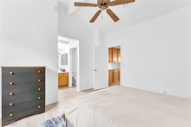 bedroom with ceiling fan, beam ceiling, light wood-type flooring, connected bathroom, and high vaulted ceiling