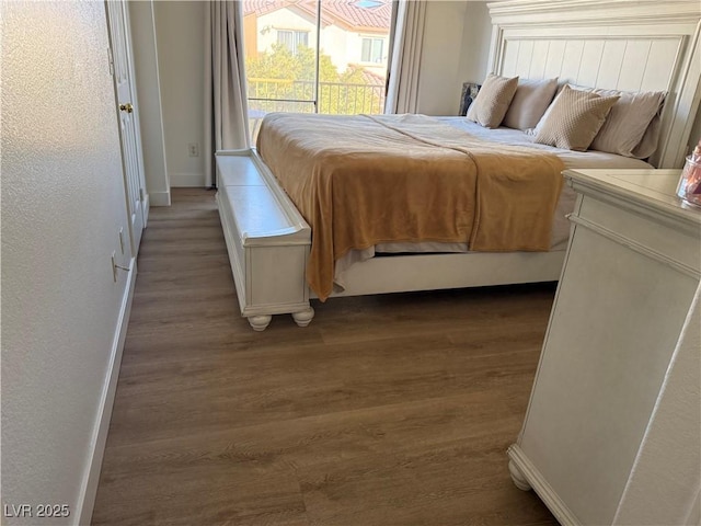 bedroom with wood-type flooring