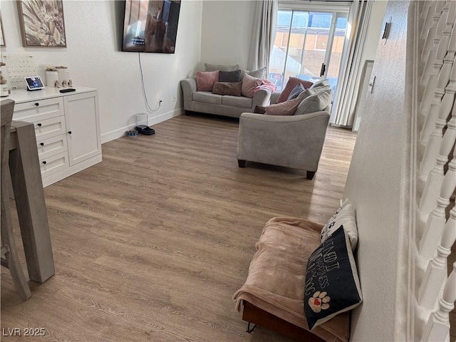 living room with light hardwood / wood-style flooring