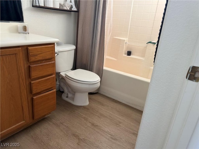 full bathroom with shower / bath combo, toilet, vanity, and wood-type flooring