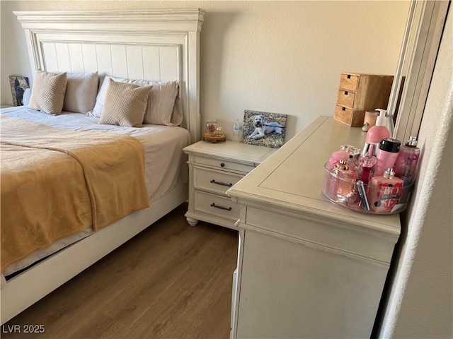 bedroom featuring dark hardwood / wood-style floors