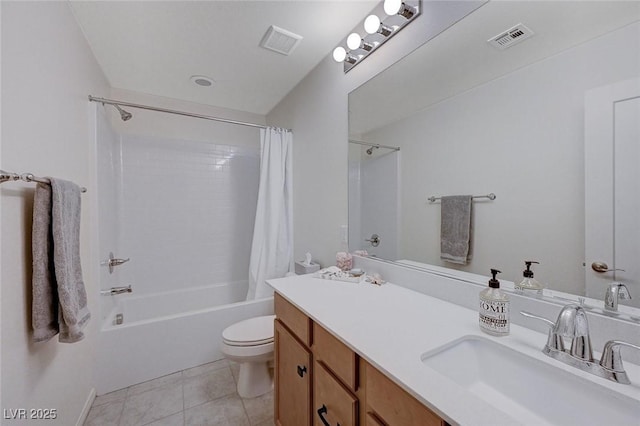 full bathroom featuring tile patterned flooring, shower / tub combo with curtain, vanity, and toilet