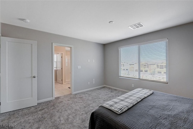 bedroom featuring light carpet