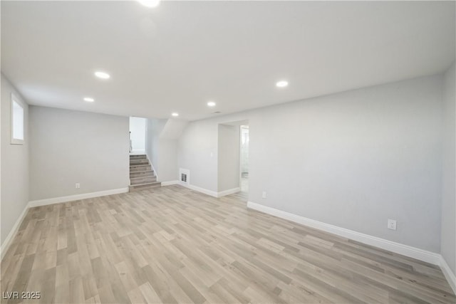 basement featuring light hardwood / wood-style flooring