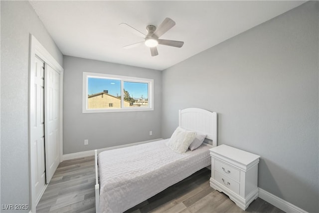 bedroom featuring hardwood / wood-style floors, a closet, and ceiling fan