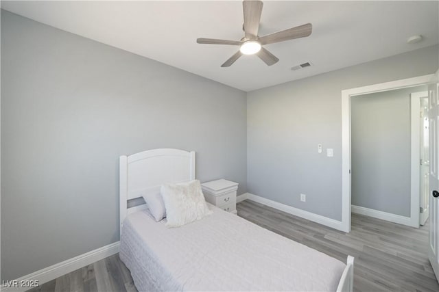 bedroom featuring hardwood / wood-style floors and ceiling fan