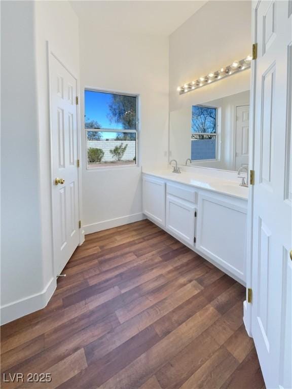 bathroom featuring vanity and hardwood / wood-style flooring