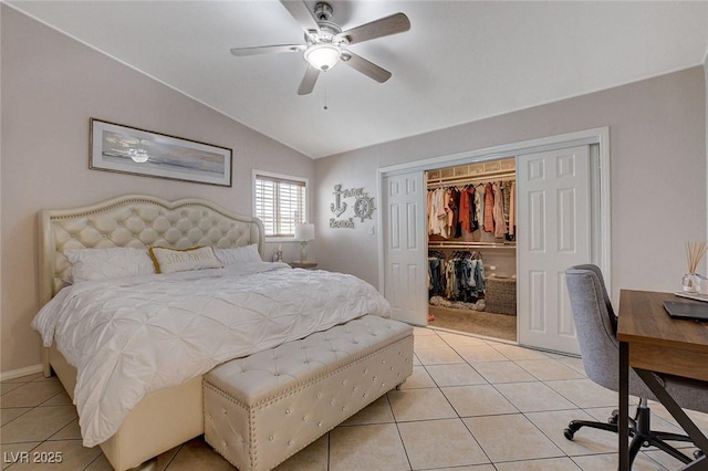 tiled bedroom with a closet, ceiling fan, and vaulted ceiling