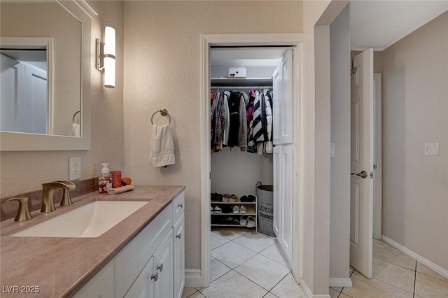 bathroom with vanity and tile patterned floors