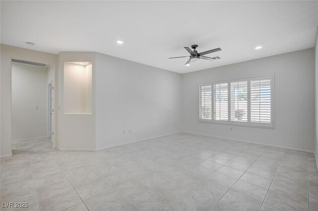 unfurnished room with ceiling fan and light tile patterned floors