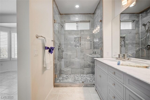 bathroom with vanity, tile patterned flooring, and a shower with shower door