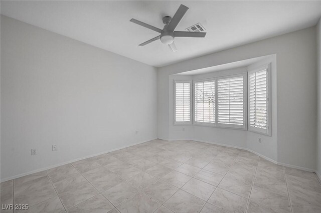 unfurnished room with light tile patterned flooring and ceiling fan