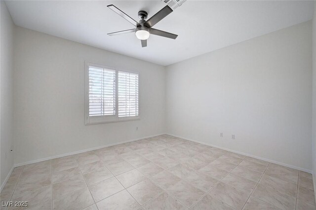 spare room featuring ceiling fan and light tile patterned floors