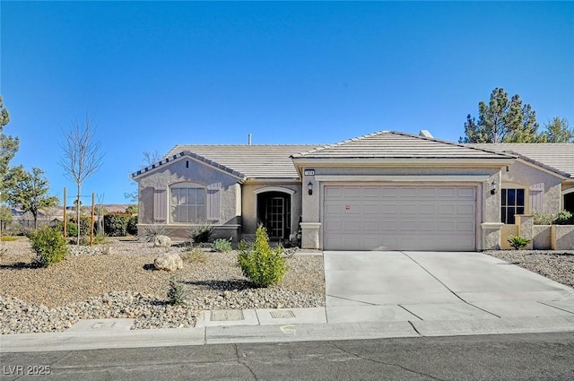 single story home featuring a tile roof, driveway, an attached garage, and stucco siding