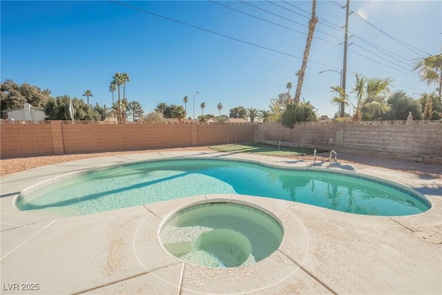 view of pool featuring an in ground hot tub