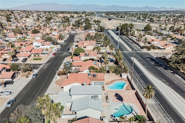 drone / aerial view featuring a mountain view