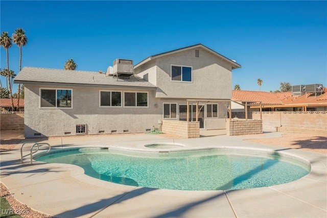 rear view of house featuring a patio and cooling unit