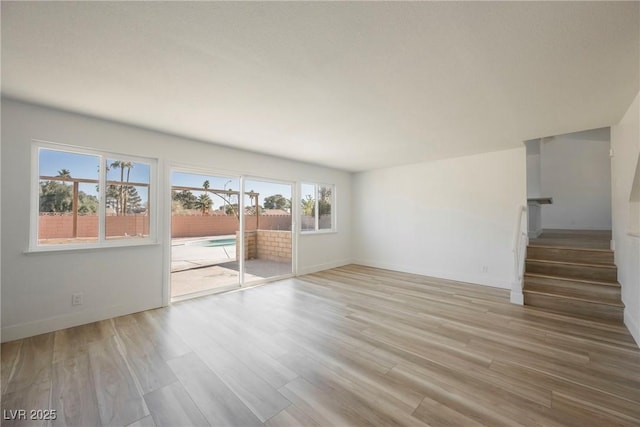 spare room with light hardwood / wood-style flooring