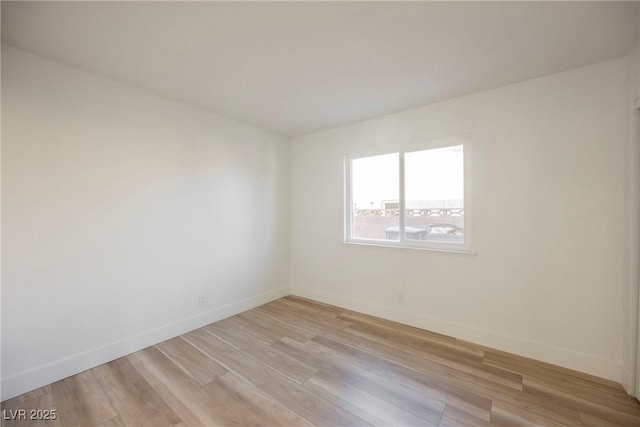 unfurnished room with light hardwood / wood-style flooring