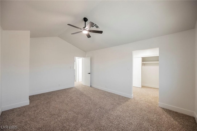 carpeted empty room with lofted ceiling and ceiling fan