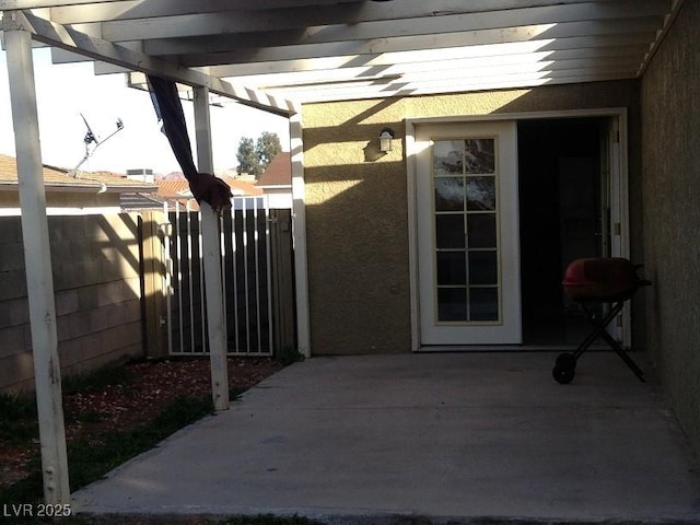 view of patio / terrace featuring area for grilling and fence