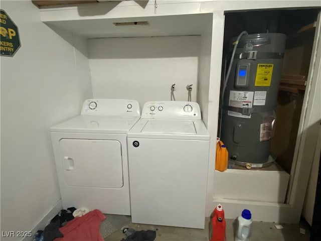 washroom with laundry area, water heater, and separate washer and dryer