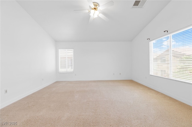 unfurnished room with lofted ceiling, light colored carpet, and ceiling fan