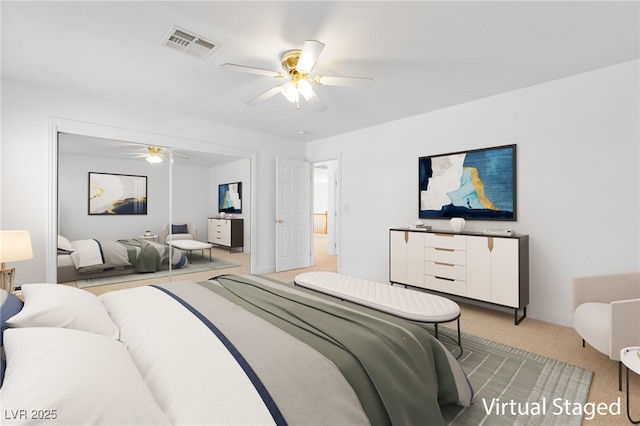 bedroom featuring ceiling fan and light carpet