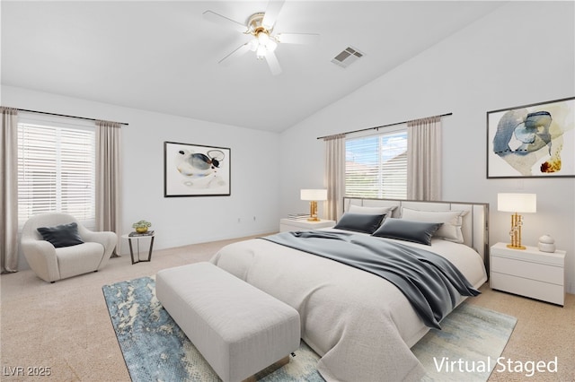 bedroom with ceiling fan, light colored carpet, and lofted ceiling