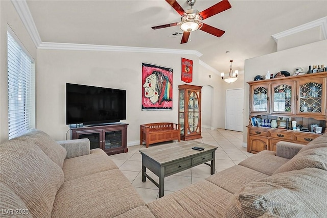 living room featuring crown molding, vaulted ceiling, light tile patterned flooring, and ceiling fan with notable chandelier