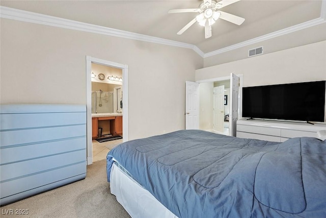 carpeted bedroom featuring lofted ceiling, ensuite bathroom, ceiling fan, and ornamental molding