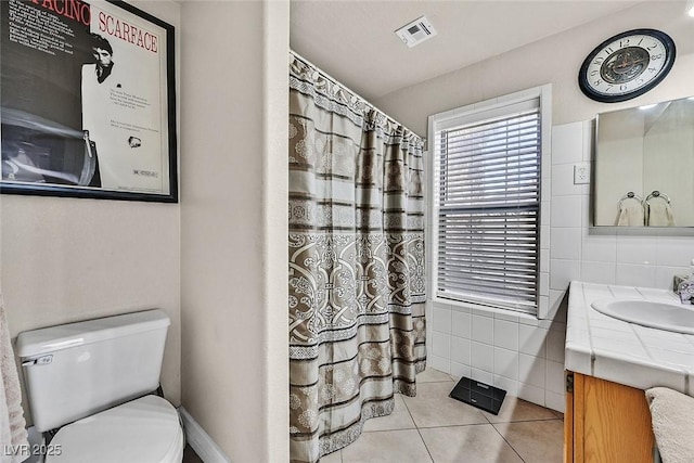 bathroom featuring tile walls, tile patterned flooring, vanity, and toilet