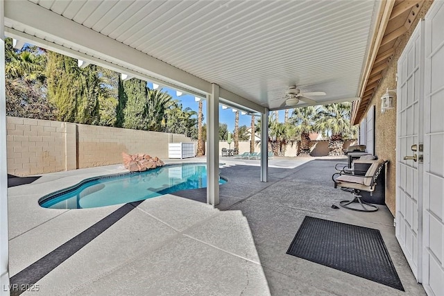 view of pool featuring a patio area and ceiling fan