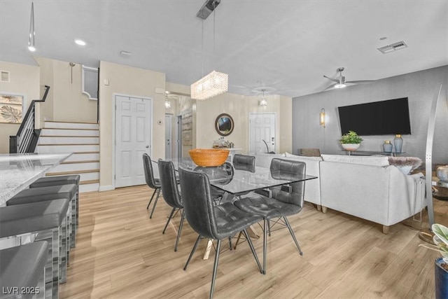 dining space featuring ceiling fan and light hardwood / wood-style floors