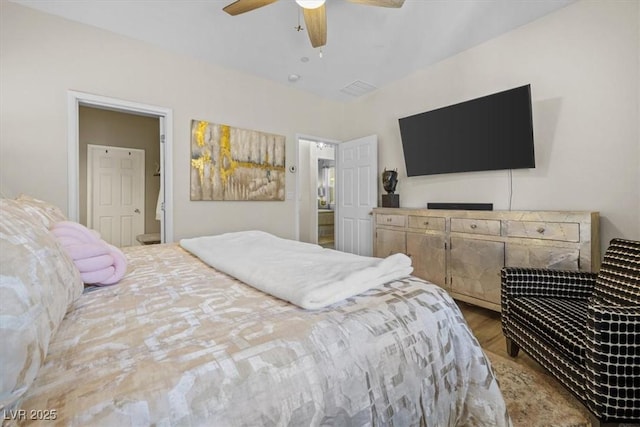 bedroom with ceiling fan and hardwood / wood-style flooring