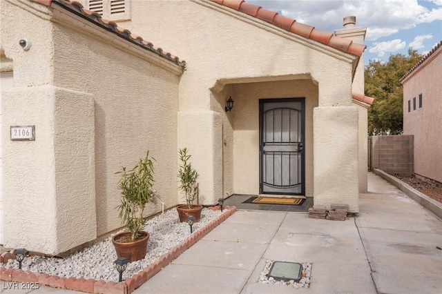 doorway to property featuring a patio